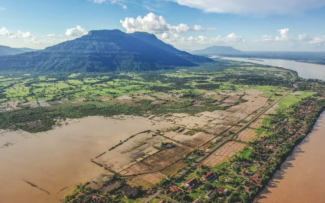 Aerial view of Phou Khao mountain, rice fields and the Mekong at Champasak, Southern Laos