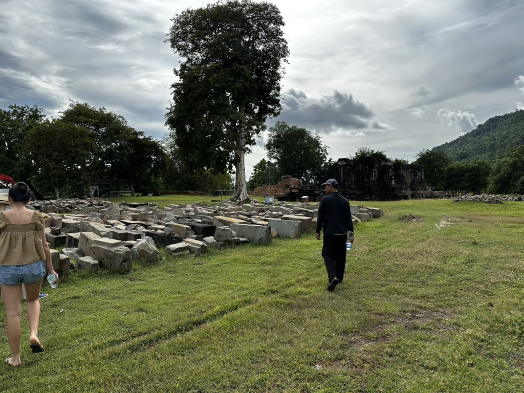 The restoration site at Hong Nang Sida, sandstone blocks laid out on the ground, Champasak, southern Laos